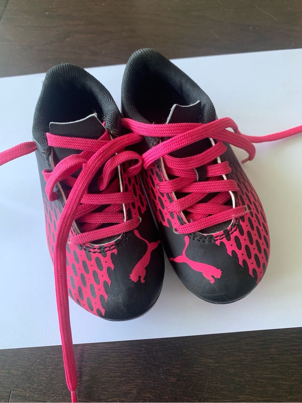Puma Kids Black and Hot Pink ground soccer cleats
